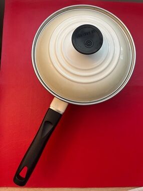 Le Creuset Cream Saucepan with Black Handle and Lid